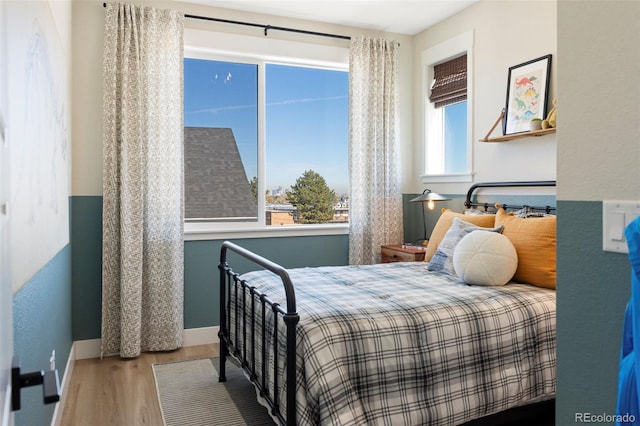 bedroom with wood-type flooring