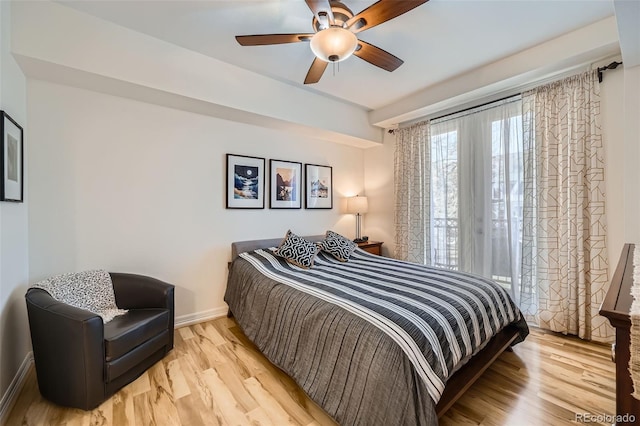 bedroom with light hardwood / wood-style floors and ceiling fan