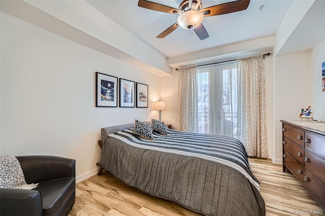 bedroom featuring light hardwood / wood-style floors and ceiling fan