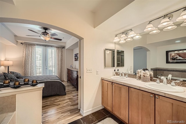 bathroom with tile patterned floors, ceiling fan, and vanity