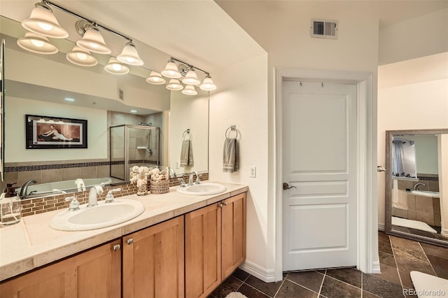 bathroom featuring tile patterned floors, vanity, and separate shower and tub