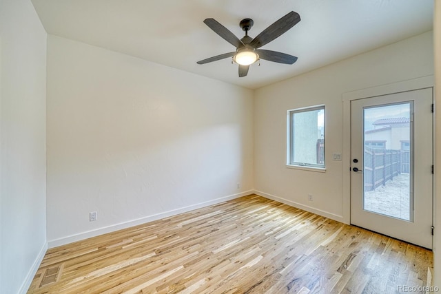 spare room with ceiling fan and light hardwood / wood-style flooring