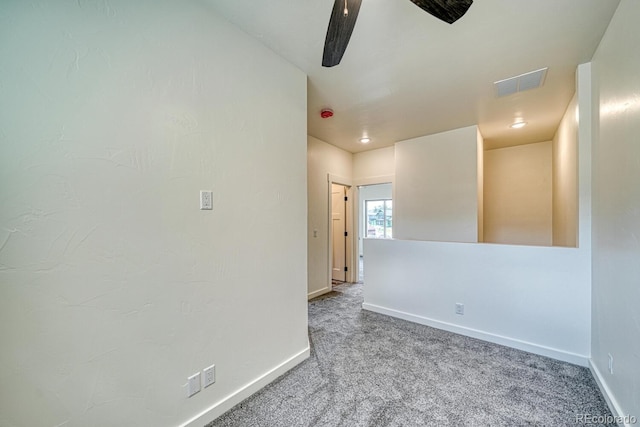 spare room with ceiling fan and carpet flooring