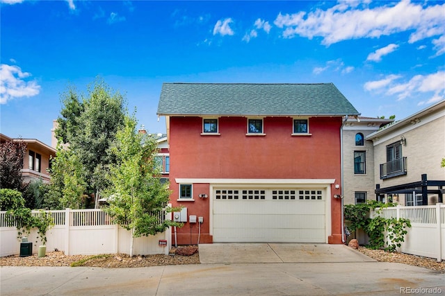 11776 Perry St, Westminster, CO 80031 - view of front of house featuring fence, roof with shingles, stucco siding, concrete driveway, and an attached garage