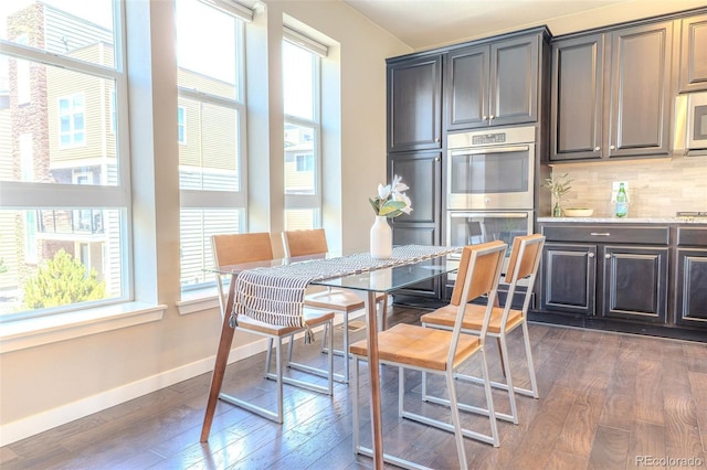 15738 E Broncos Pl, Englewood, CO 80112 - dining space with dark wood-style flooring