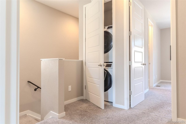 15738 E Broncos Pl, Englewood, CO 80112 - laundry room with estacked washer and dryer and carpet flooring