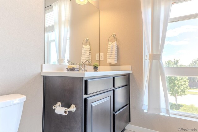 15738 E Broncos Pl, Englewood, CO 80112 - half bathroom with vanity and healthy amount of natural light