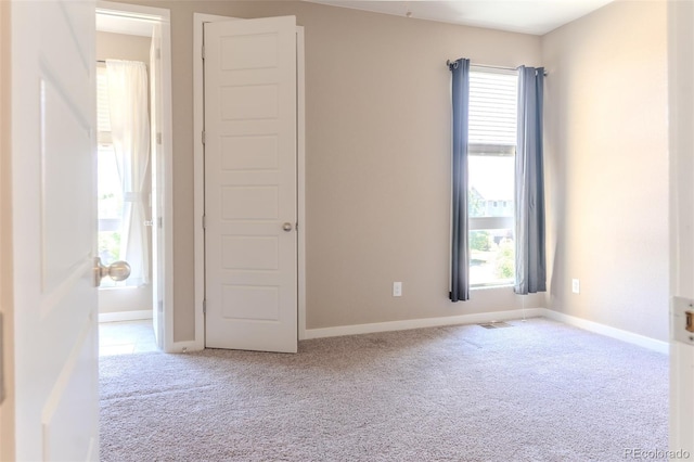 15738 E Broncos Pl, Englewood, CO 80112 - unfurnished room featuring light carpet and plenty of natural light