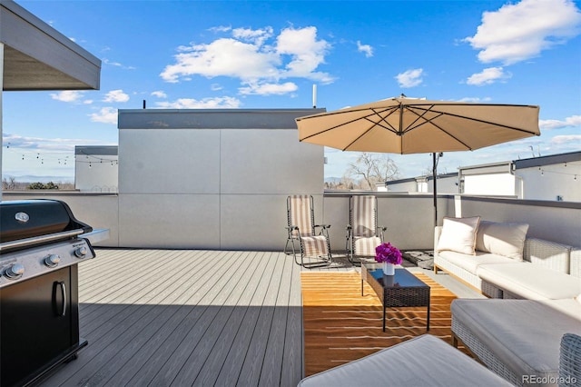 deck featuring grilling area and an outdoor hangout area