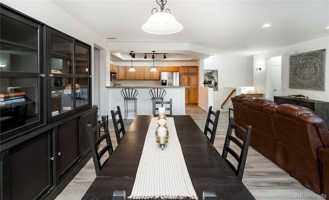 dining room with light wood-type flooring