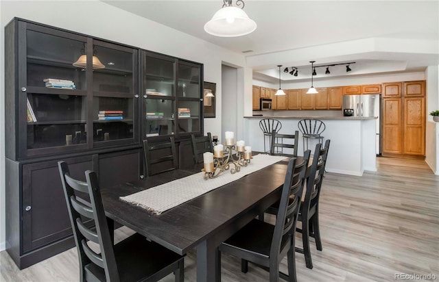 dining space featuring light hardwood / wood-style floors