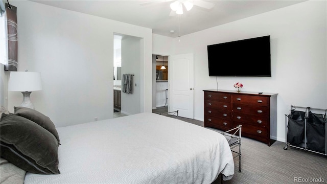 carpeted bedroom with connected bathroom and ceiling fan