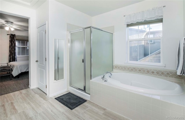 bathroom featuring separate shower and tub