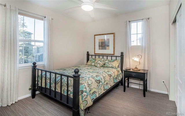 carpeted bedroom with ceiling fan