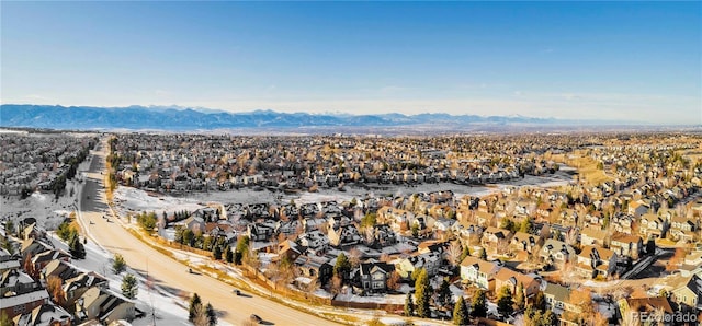 birds eye view of property featuring a mountain view