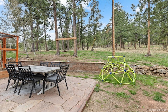 518 Pine Dr, Bailey, CO 80421 - view of patio featuring outdoor dining area and view of wooded area