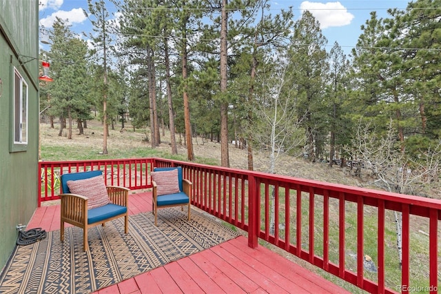 518 Pine Dr, Bailey, CO 80421 - wooden deck featuring view of wooded area