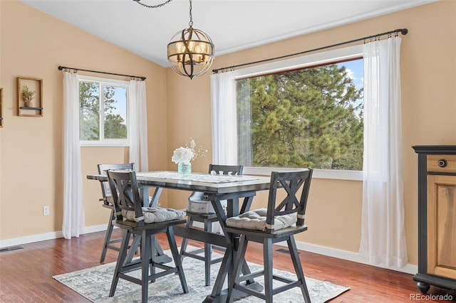 518 Pine Dr, Bailey, CO 80421 - dining area featuring a chandelier, dark wood-style flooring, and lofted ceiling