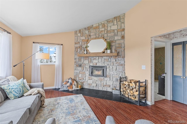 518 Pine Dr, Bailey, CO 80421 - living room with vaulted ceiling, wood finished floors, and a fireplace