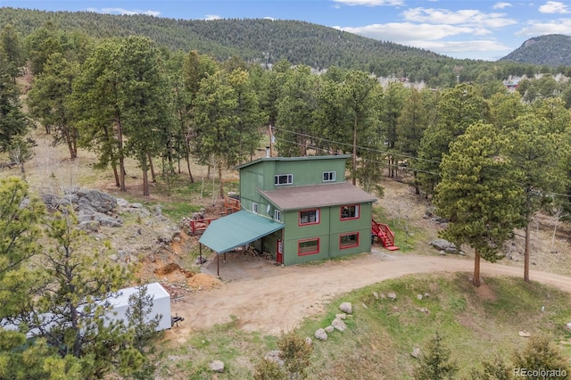 518 Pine Dr, Bailey, CO 80421 - view of subject property with a forest and a mountainous background