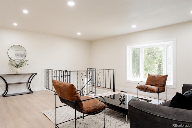 12452 W Dumbarton Pl, Morrison, CO 80465 - living area featuring wood finished floors and recessed lighting