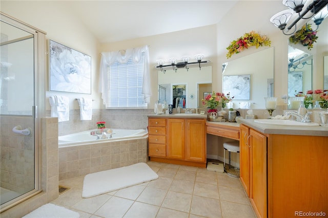 bathroom featuring independent shower and bath, lofted ceiling, vanity, and tile patterned floors