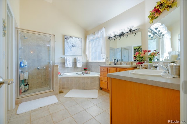 bathroom with independent shower and bath, vanity, vaulted ceiling, and tile patterned floors