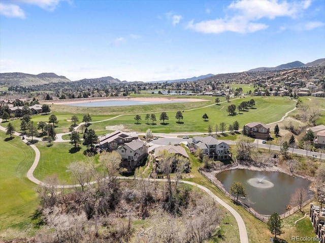 bird's eye view featuring a water and mountain view, golf course view, and a residential view