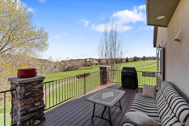wooden terrace with a lawn and golf course view