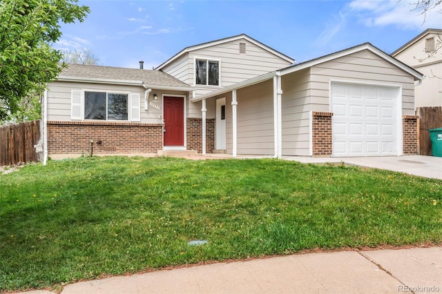 split level home featuring brick siding, an attached garage, and driveway