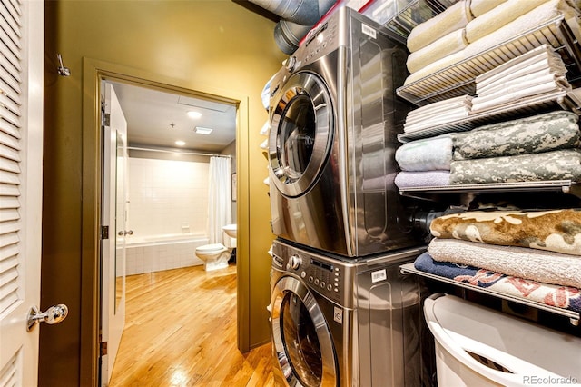 1863 Wazee St Unit 4B, Denver, CO 80202 - laundry area with estacked washer and dryer and wood finished floors