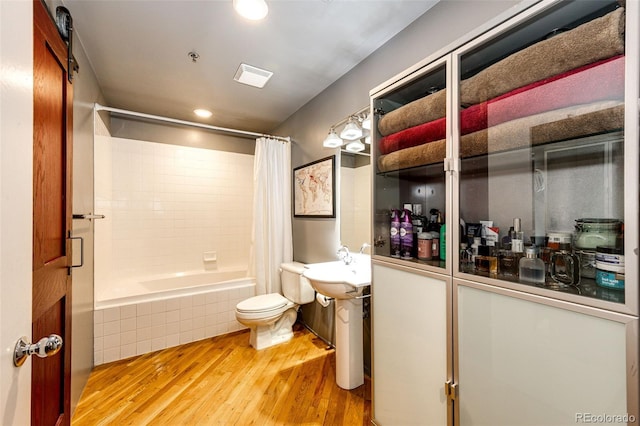 1863 Wazee St Unit 4B, Denver, CO 80202 - bathroom with wood finished floors, toilet, tiled shower / bath, and recessed lighting