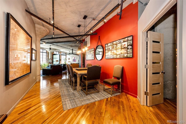 1863 Wazee St Unit 4B, Denver, CO 80202 - dining space with wood finished floors, rail lighting, and baseboards