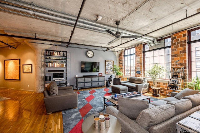 1863 Wazee St Unit 4B, Denver, CO 80202 - living room with wood finished floors, ceiling fan, and baseboards