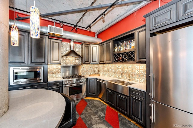 1863 Wazee St Unit 4B, Denver, CO 80202 - kitchen with stainless steel appliances, wall chimney exhaust hood, light countertops, backsplash, and a sink