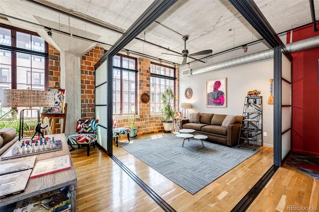 1863 Wazee St Unit 4B, Denver, CO 80202 - living area with hardwood / wood-style floors, ceiling fan, and healthy amount of natural light