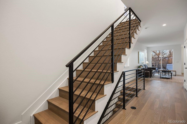 staircase featuring hardwood / wood-style floors