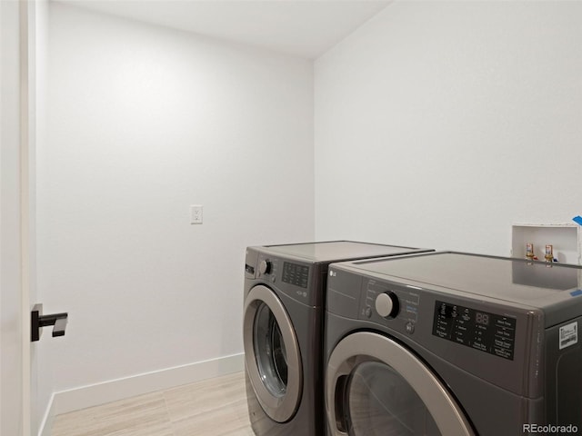 laundry area with independent washer and dryer