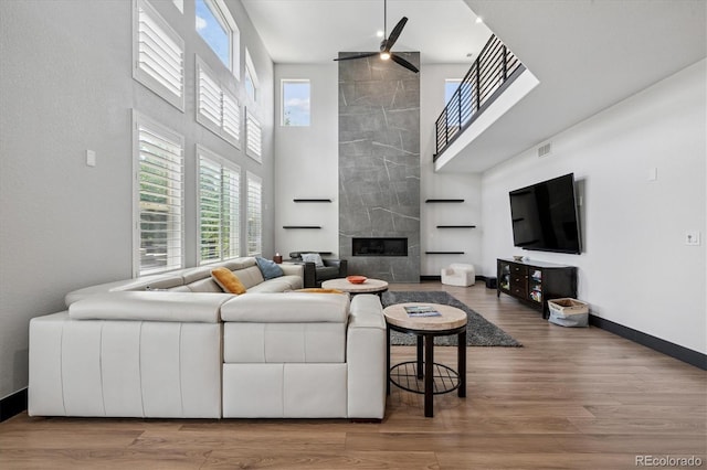 5665 Vistancia Ct, Parker, CO 80134 - living area with a high ceiling, ceiling fan, healthy amount of natural light, and wood finished floors