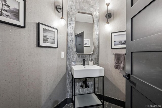 5665 Vistancia Ct, Parker, CO 80134 - bathroom featuring a sink and baseboards