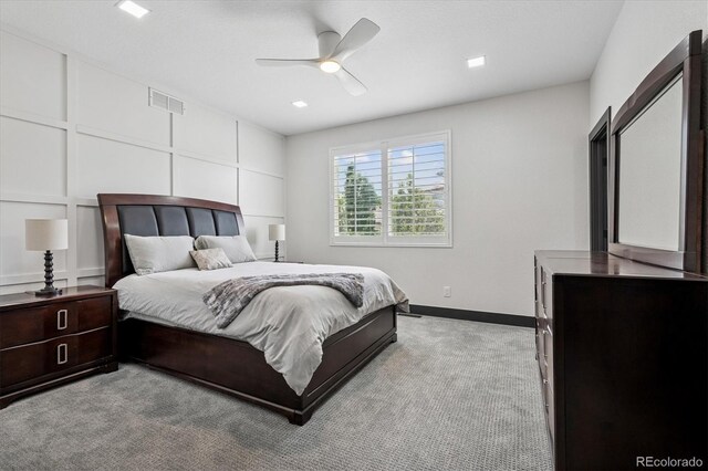5665 Vistancia Ct, Parker, CO 80134 - bedroom featuring light colored carpet, a decorative wall, and a ceiling fan
