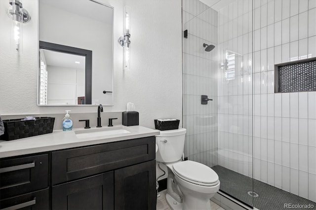 5665 Vistancia Ct, Parker, CO 80134 - bathroom featuring vanity, a tile shower, and a textured wall