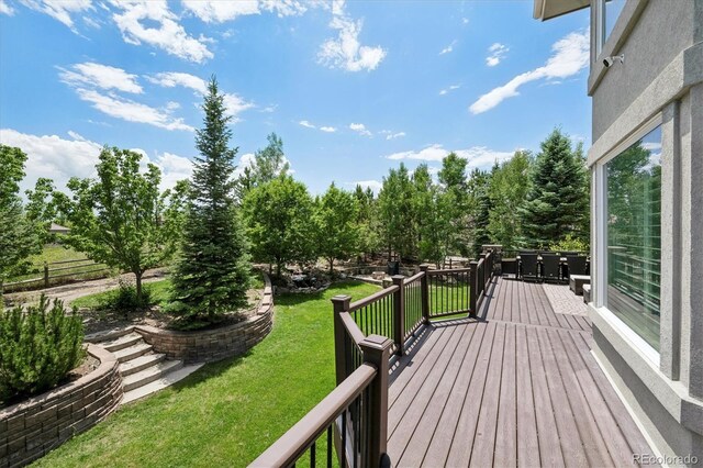 5665 Vistancia Ct, Parker, CO 80134 - wooden terrace with a yard