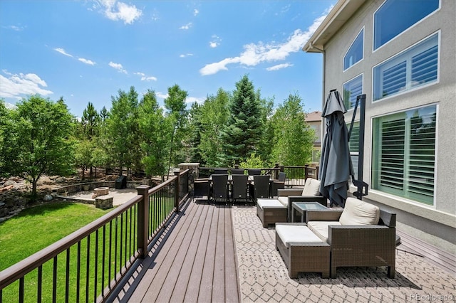 5665 Vistancia Ct, Parker, CO 80134 - wooden deck with outdoor dining space and a lawn