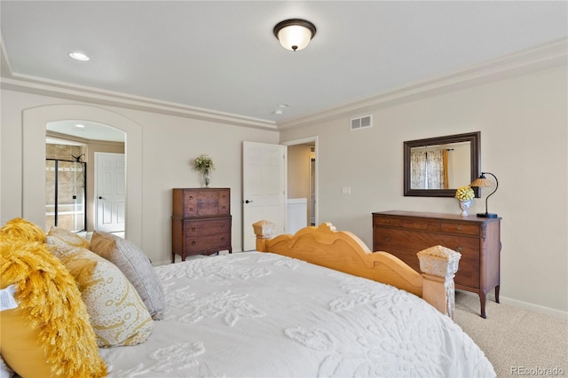 carpeted bedroom featuring arched walkways, recessed lighting, visible vents, baseboards, and ornamental molding