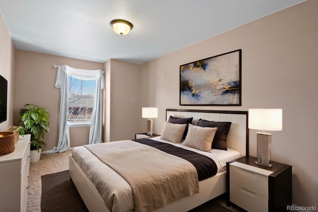 bedroom featuring carpet floors and baseboards