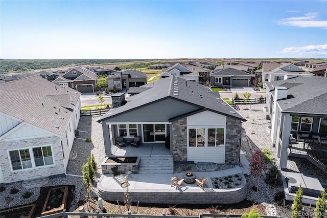 7169 Canyon Sky Trl, Castle Pines, CO 80108 - rear view of house with a residential view, a patio, and a fenced backyard