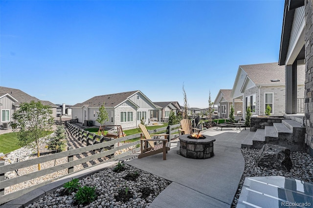 7169 Canyon Sky Trl, Castle Pines, CO 80108 - view of home's community featuring a residential view, a fire pit, and a patio