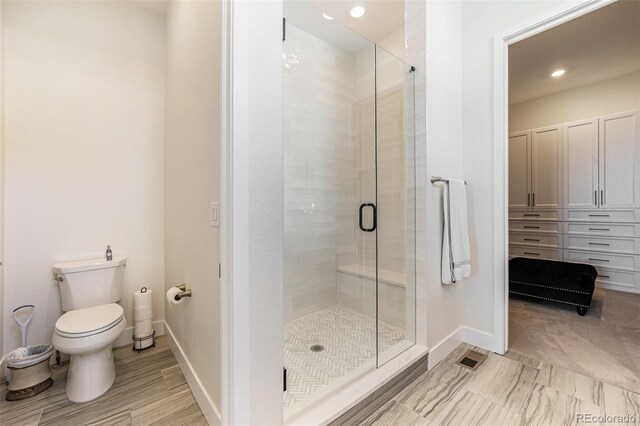 7169 Canyon Sky Trl, Castle Pines, CO 80108 - full bathroom with a stall shower, toilet, baseboards, and recessed lighting