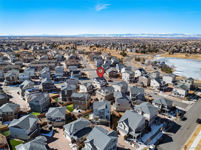 birds eye view of property with a water view and a residential view